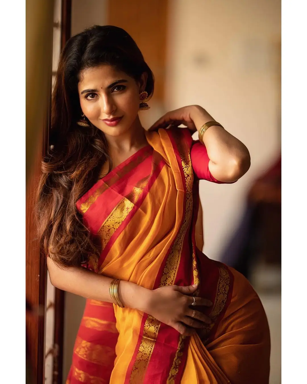 Indian Girl Iswarya Menon In Traditional Orange Saree Sleeveless Blouse